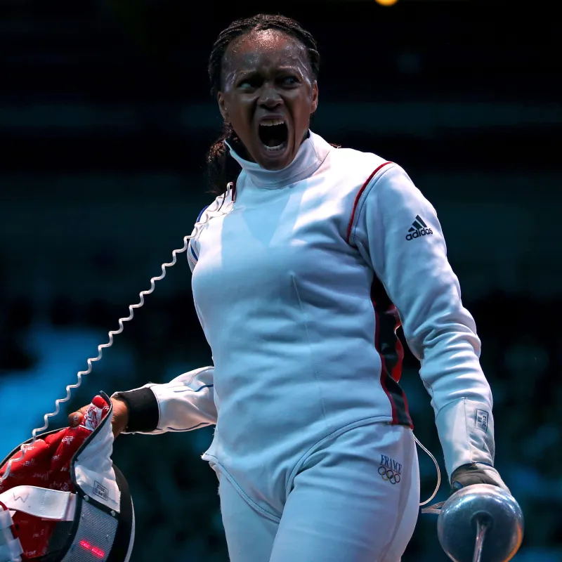 LONDON, ENGLAND - JULY 30:  Laura Flessel-Colovic of France reacts against Simona Gherman of Romania during the Women's Epee Individual Fencing round of 16 on Day 3 of the London 2012 Olympic Games at ExCeL on July 30, 2012 in London, England.  (Photo by Hannah Peters/Getty Images)